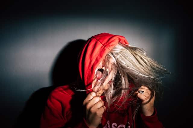 Woman wearing red hoodie